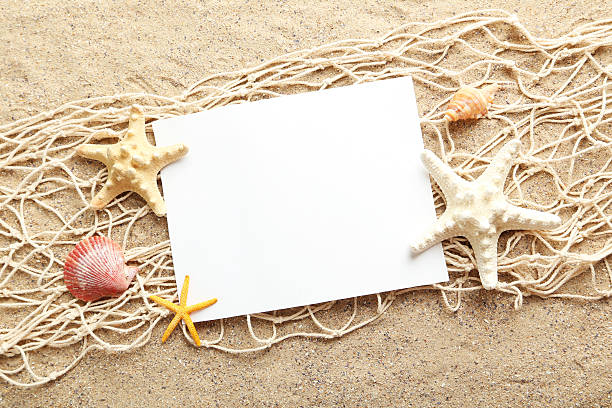 istock Empty blank of sheet paper on beach sand 530934706