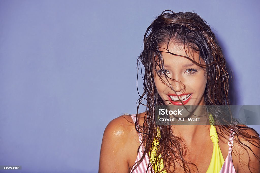 Summer is here, are you ready to get wet? Shot of a young woman looking ready for summer One Woman Only Stock Photo