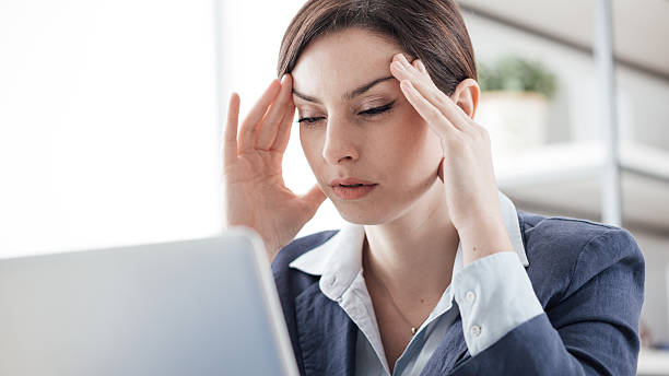 istock Exhausted businesswoman at work 530937646