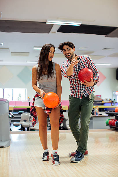 istock Cheerful Friends Bowling Together 530938636