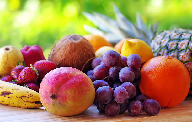 istock mixed fruits on wooden table 530938726