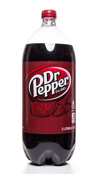 Miami, USA - October 20, 2014: Dr Pepper carbonated soft drink soda 2 liter plastic bottle isolated on white.