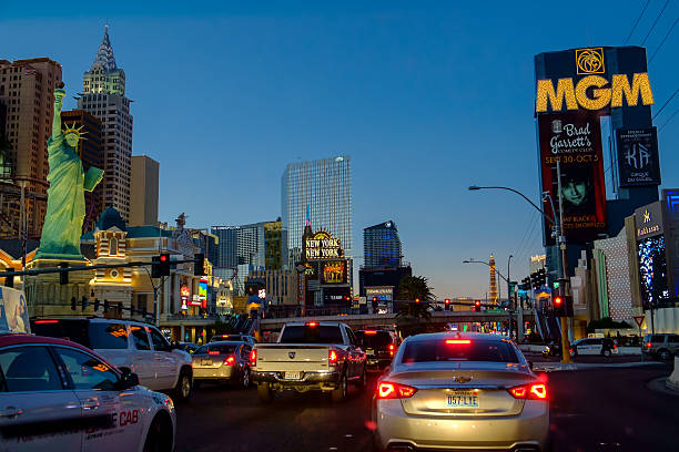 Las Vegas, USA - October 6, 2014: Traffic at Las Vegas Boulevard by night. Six of the world's largest hotels are situated on Las Vegas Boulevard.