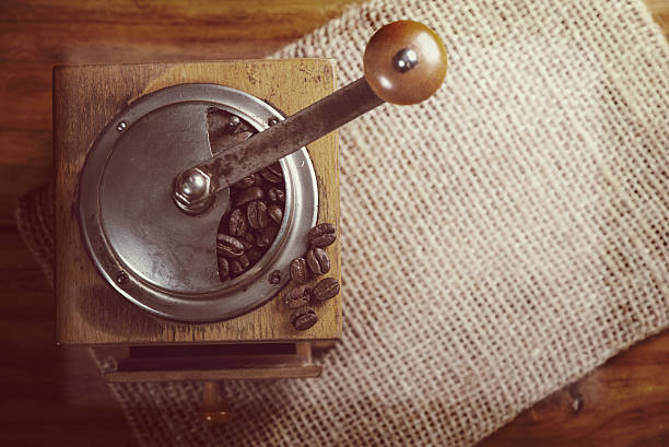 istock top view over old manual coffee grinder on wooden table 530943041
