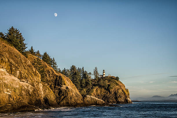 Moonrise over the Cape Disappointment Lighthouse stock photo