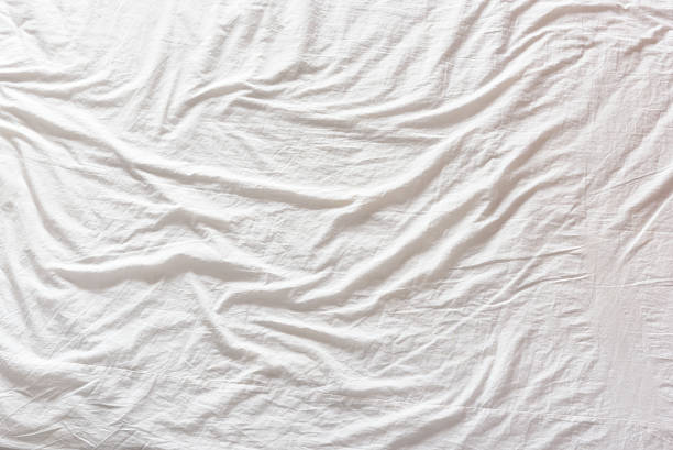 istock Top view of a messy bedding sheet after night sleep. 530943870