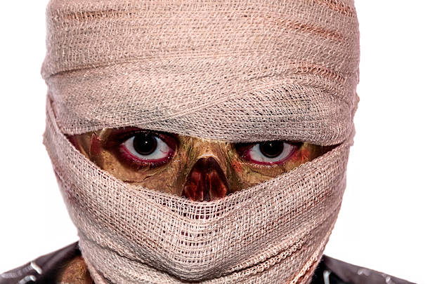 istock man with face bandaged up, rotten flesh colour image 530943997