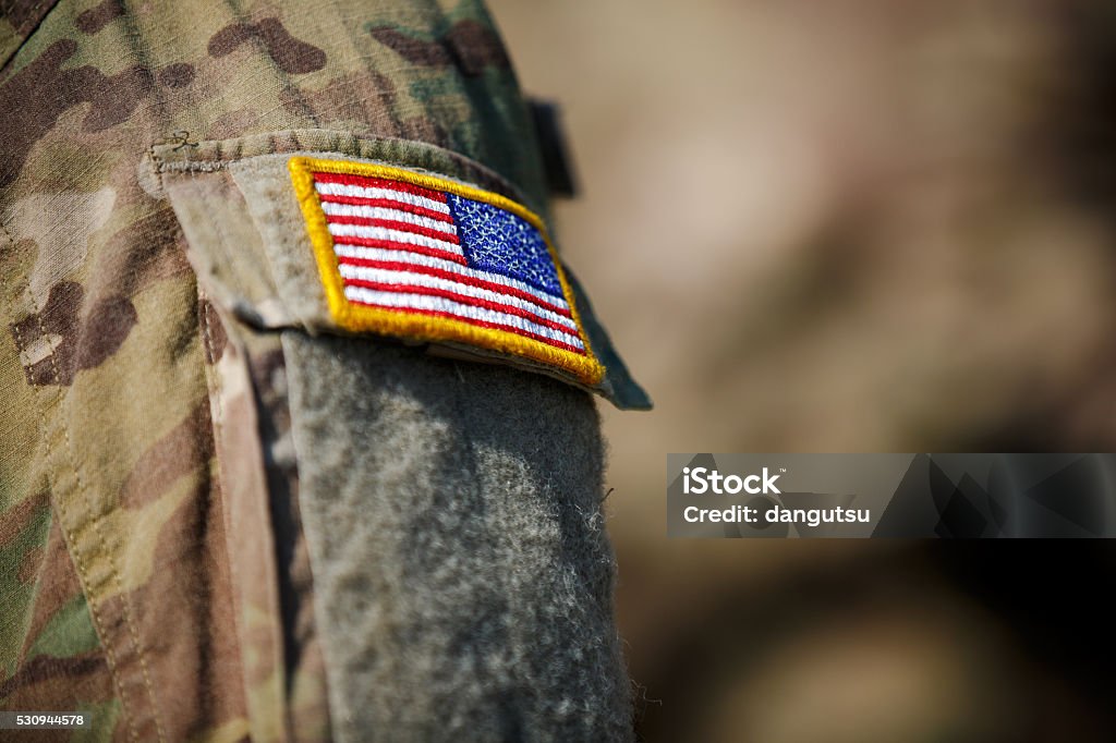 USA flag and US Army patch on solder's uniform USA flag and US Army Veteran Stock Photo