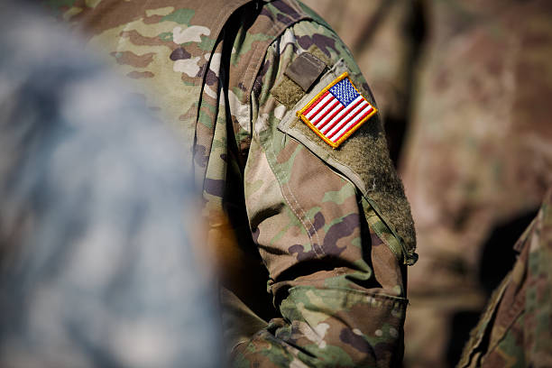 istock USA flag and US Army patch on solder's uniform 530944770