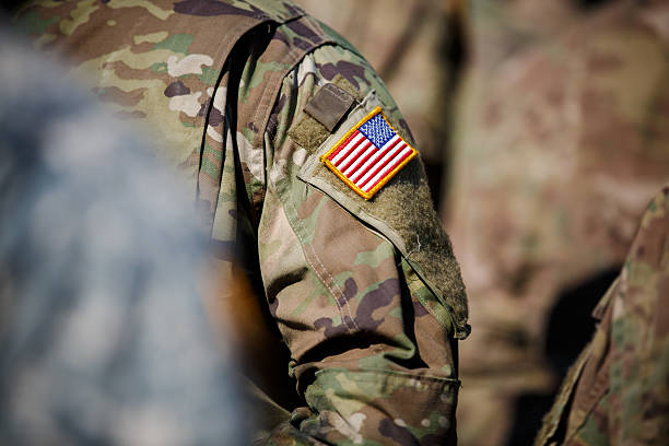 istock USA flag and US Army patch on solder's uniform 530944828