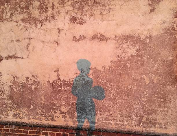istock Shadow of a child with a soccer ball 530944840