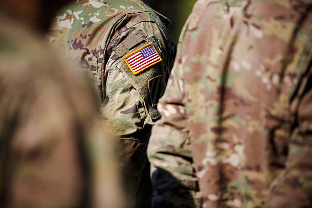 istock USA flag and US Army patch on solder's uniform 530944948