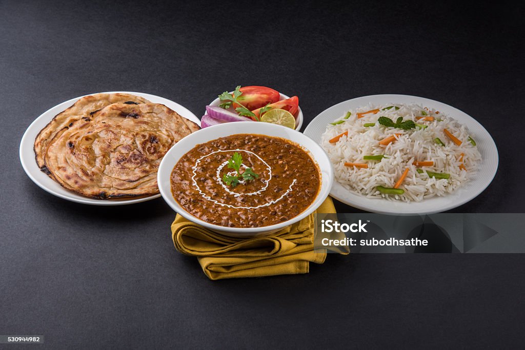 Dal Makhani or Daal Makhani, indian lunch/dinner menu Dal Makhani or daal makhni or Daal makhani, indian lunch/dinner item served with plain rice and butter Roti, Chapati, Paratha and salad Indian Food Stock Photo