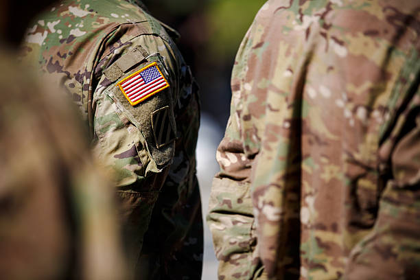 istock USA flag and US Army patch on solder's uniform 530945014