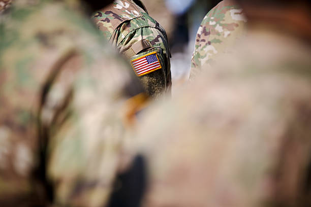 istock USA flag and US Army patch on solder's uniform 530945090