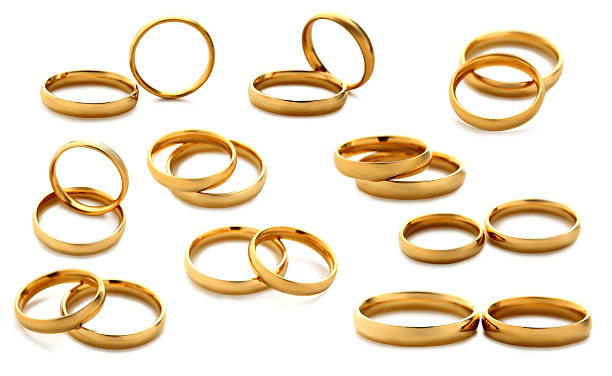 istock Golden wedding rings isolated on a white, collage 530945264