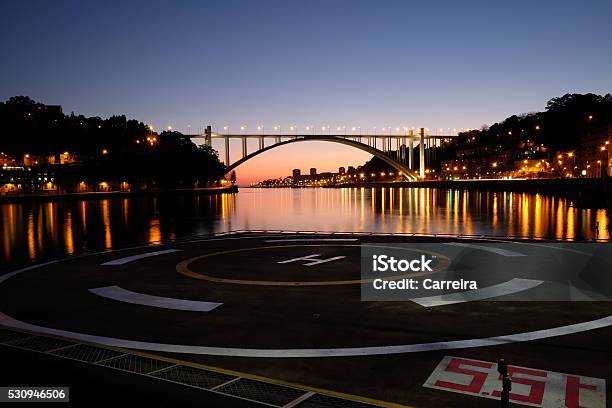Heliport And Arrabida Bridge Stock Photo - Download Image Now - Helipad, Night, Illuminated