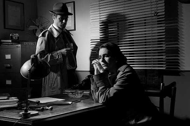 istock Detective interviewing a young pensive woman in his office 530946836