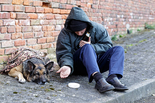 istock homeless man with his dog 530947662