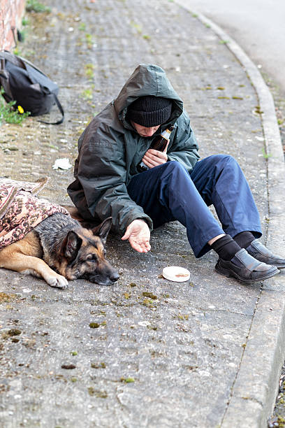 istock homeless man with his dog 530948298