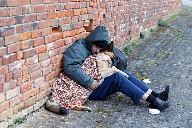 istock homeless man with his dog 530948626