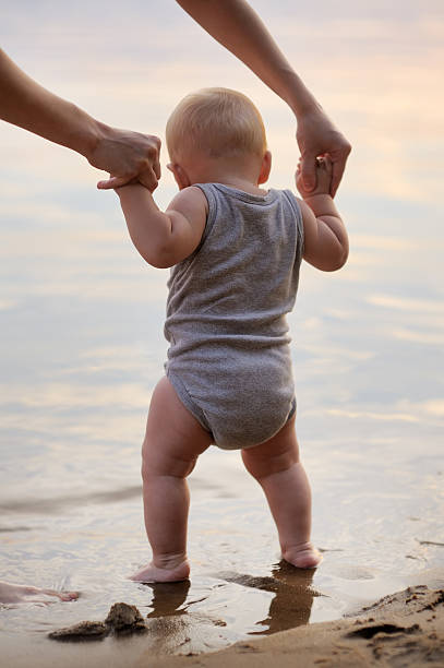 istock Little baby by the water 530948683