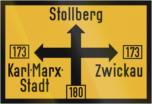 Old design (1956) of a German direction sign on a federal road showing the way to Stollberg, Karl-Marx-Stadt (Chemnitz) and Zwickau.