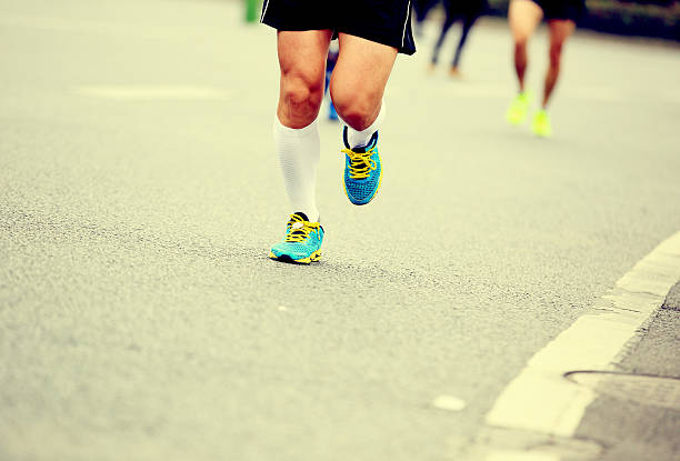 istock marathon runner athlete running on city road 530951713