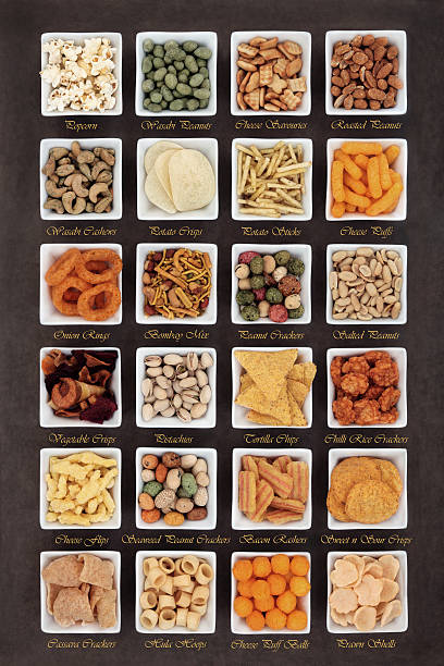 Large savoury snack food selection in square porcelain bowls with titles