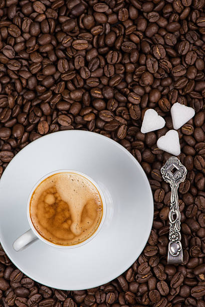 istock overhead view on cup of expresso coffee  and roasted beans 530952879