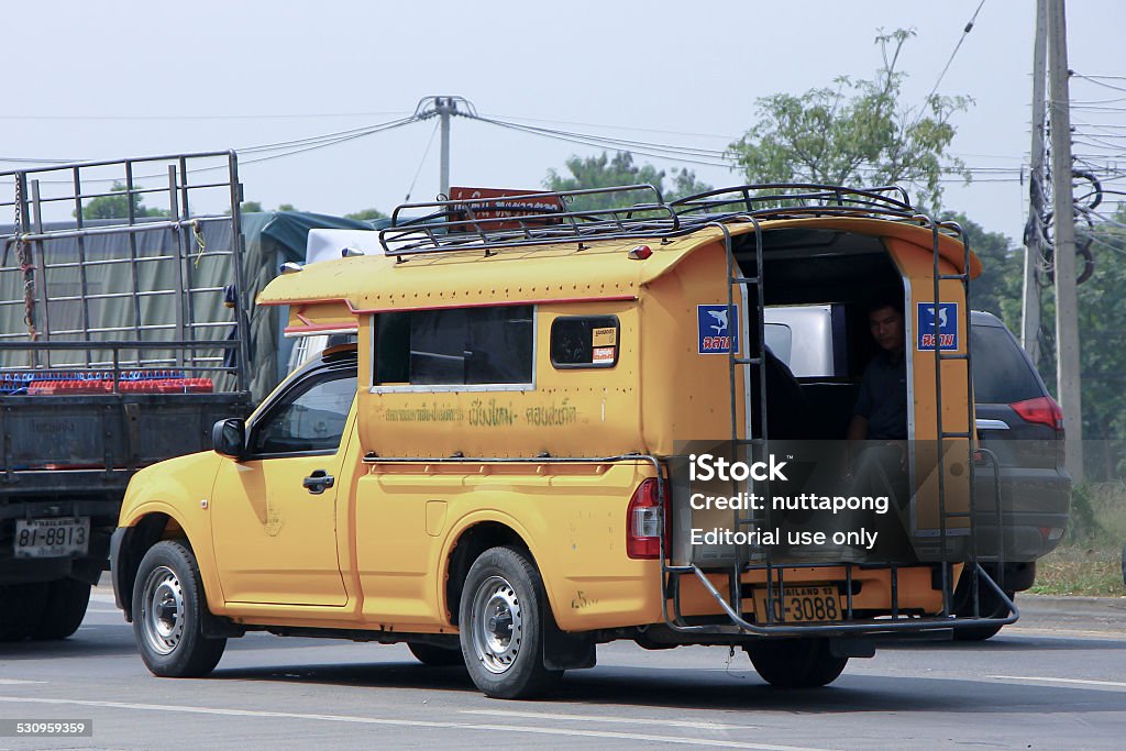 Yellow mini truck taxi chiangmai Chiangmai, Thailand - October 16, 2014: Yellow mini truck taxi chiangmai, Service between city and Doisaket district. Photo at road no 121 about 8 km from downtown Chiangmai, thailand. 2015 Stock Photo