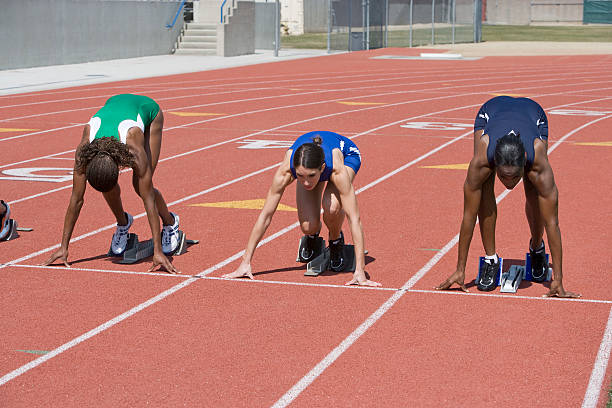 istock Female athletes in starting blocks 530961517