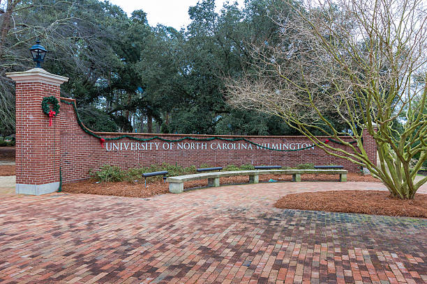 Entrance Sign at UNCW Wilmington, NC, USA - January 3, 2015: Entrance Sign at the University of North Carolina at Wilmington in Wilmington, NC. university of north carolina stock pictures, royalty-free photos & images