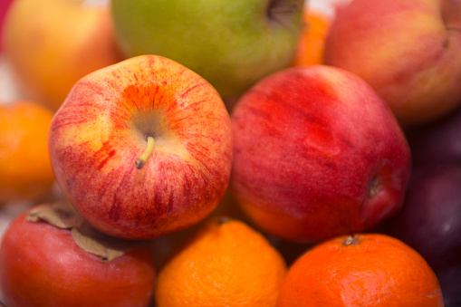 A set of mixed fruits focusing on the apples.
