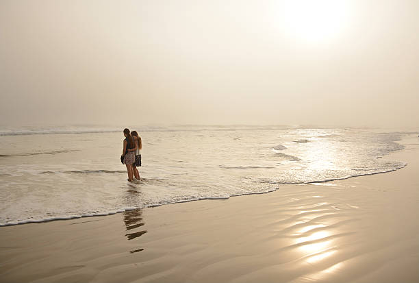 istock Sisters enjoying time together on beautiful beach. 530964259