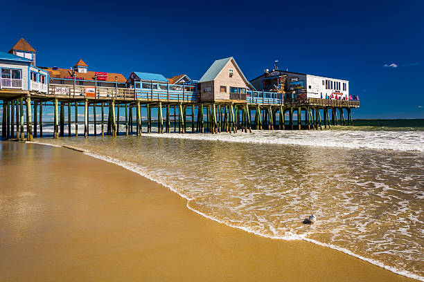 The Atlantic Ocean and pier in Old Orchard Beach, Maine. stock photo