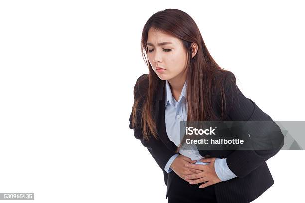 Young Asian Businesswoman Got Stomachache Stock Photo - Download Image Now - 2015, Adult, Adults Only