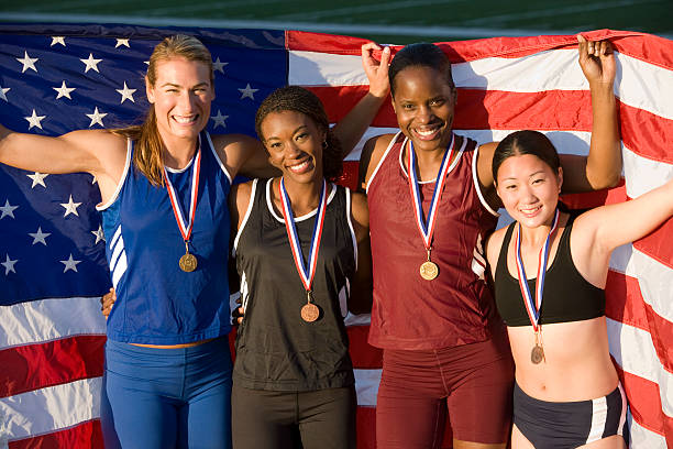 istock female athletes celebrating victory 530969489