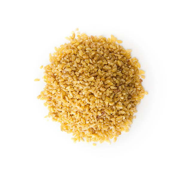 Bulgur Wheat  with copy space Bulgur Wheat  with copy space , isolated on white bulgur wheat stock pictures, royalty-free photos & images