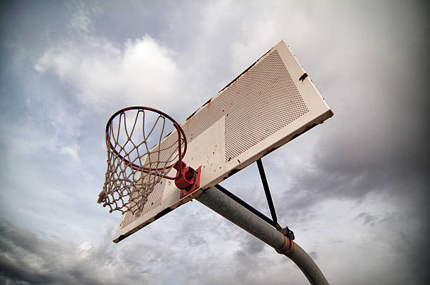 Outdoor Basketball Hoop and Dramatic Sky stock photo