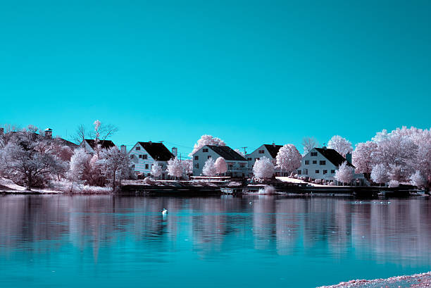 Row of house and frozen pond in Infrared stock photo