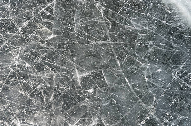 istock Used Pond Hockey Ice from Skating - Textured Background 530972261