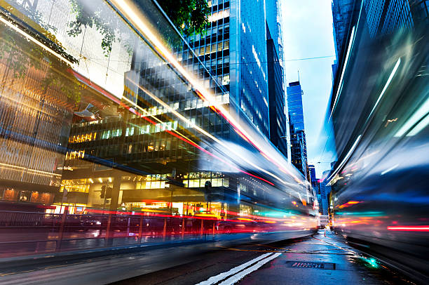 istock light trails on the modern building in Hong Kong China 530972387