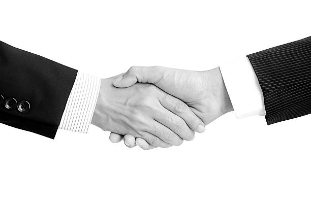 istock Handshake of businessmen - dealing & greeting concepts 530973319