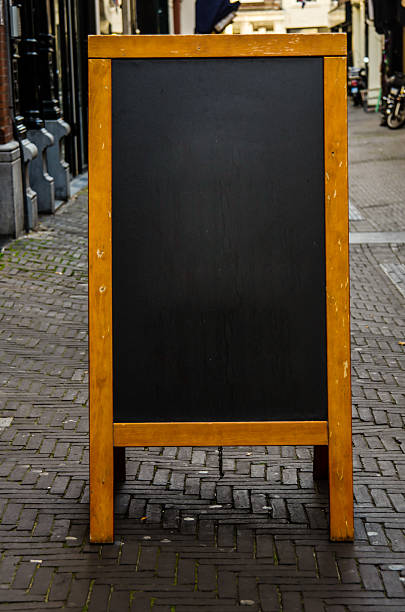 istock Empty Chalkboard on City Street 530974365