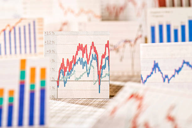 Tables with stock prices and charts stock photo