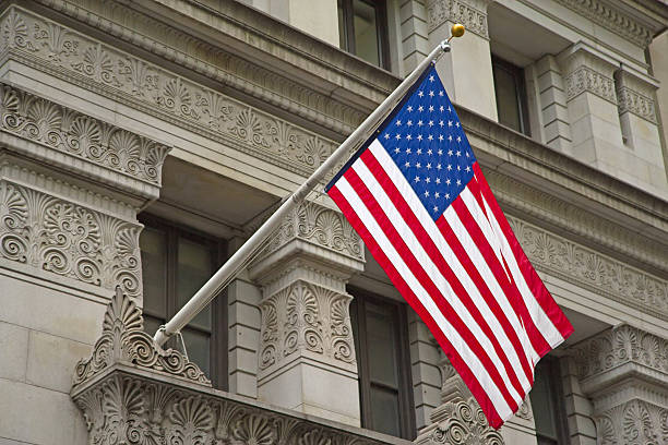 istock American flag hanging on the historic building. 530976057