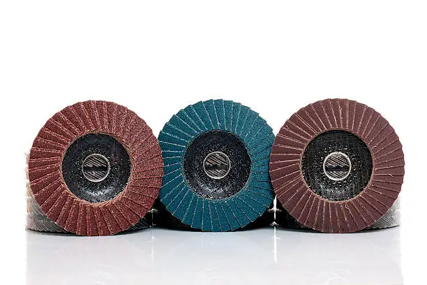 Flap abrasive disks isolated on white. Good for grinding, metal finishing, sanding. Professional equipment