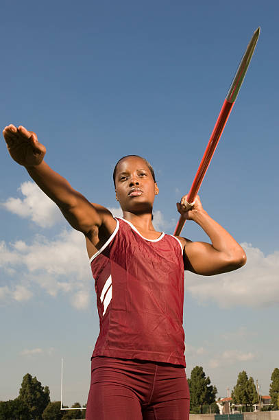 istock Female athlete throwing javelin 530980209