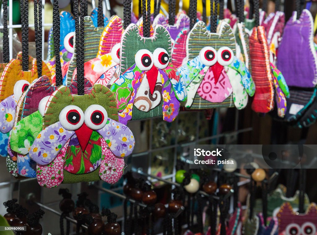 handmade colorful fabric owl key chain Loei, Thailand - October 26, 2014: The handmade colorful fabric owl key chain hanging on the rack for sale at Chiangkarn night market 2015 Stock Photo